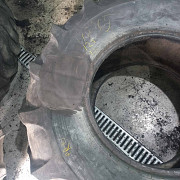 Бу шина 18.4-24 - Росава. 
Правильно: Бу шина 18,4-24 - Росава. Тальне